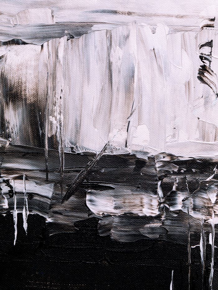 Bold and expressive abstract painting in monochrome tones with fluid patterns.